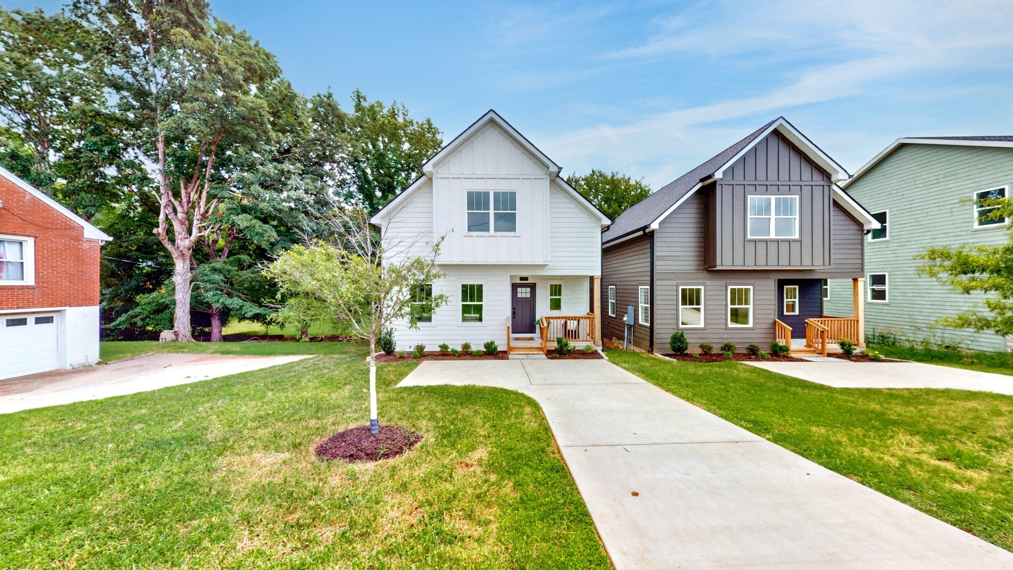 1805 Golf Club Road Old Hickory, TN 37138 - Photo 22 of 26 a front view of a house with a yard table and chairs