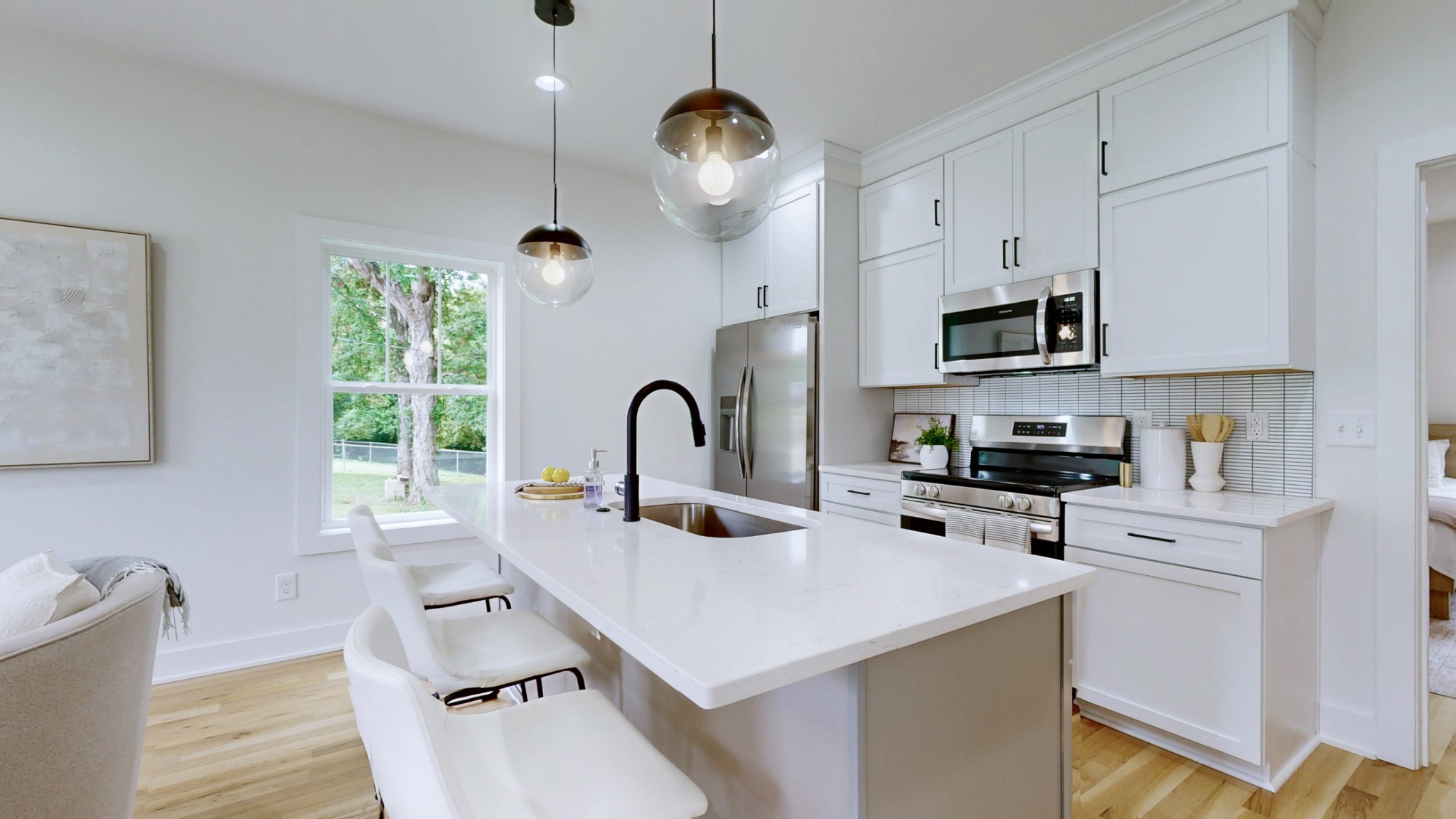 1805 Golf Club Road Old Hickory, TN 37138 - Photo 4 of 26 a kitchen with kitchen island a white counter top space a sink cabinets and appliances