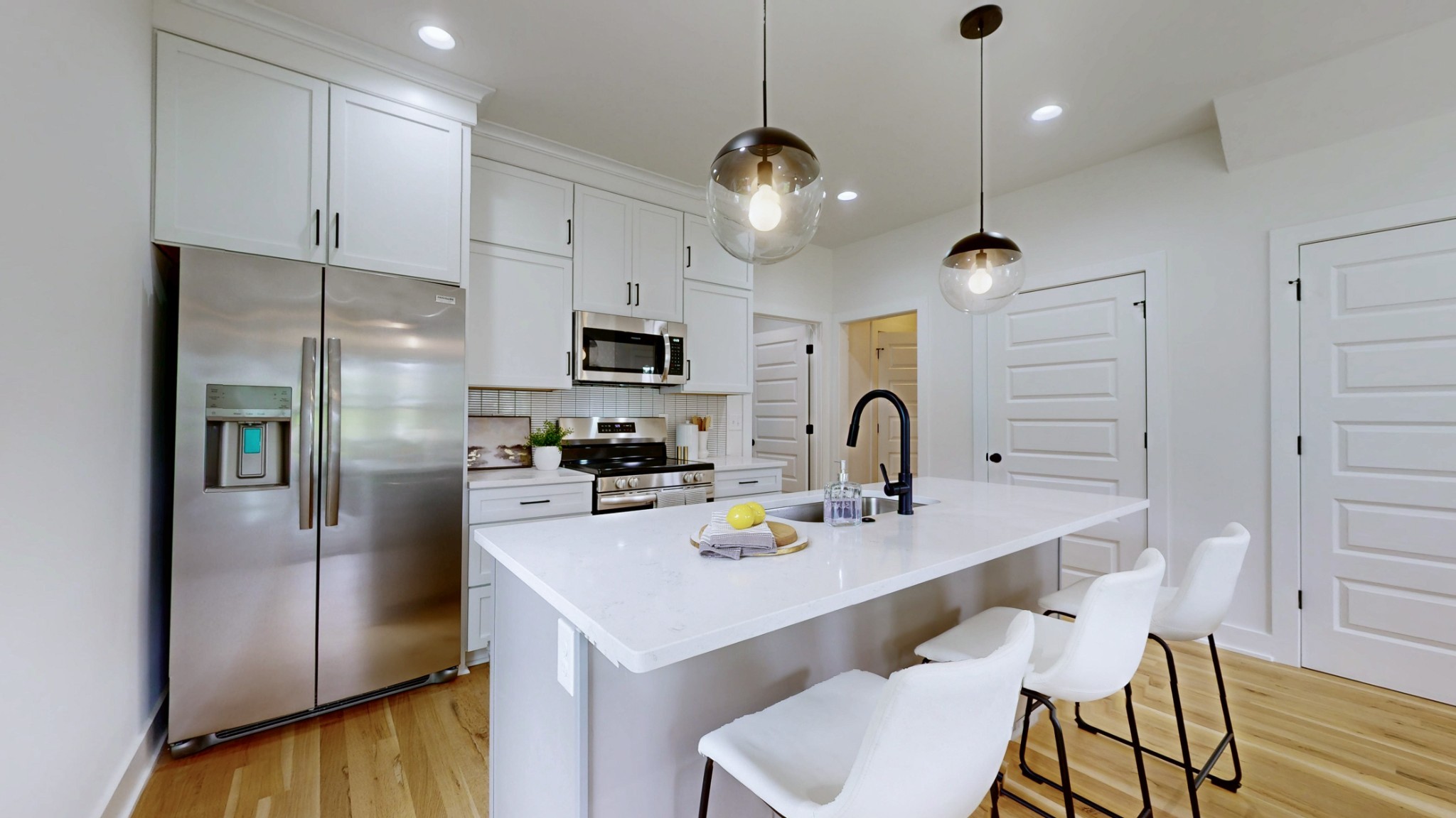 1805 Golf Club Road Old Hickory, TN 37138 - Photo 5 of 26 a kitchen with a refrigerator a stove a sink and chairs