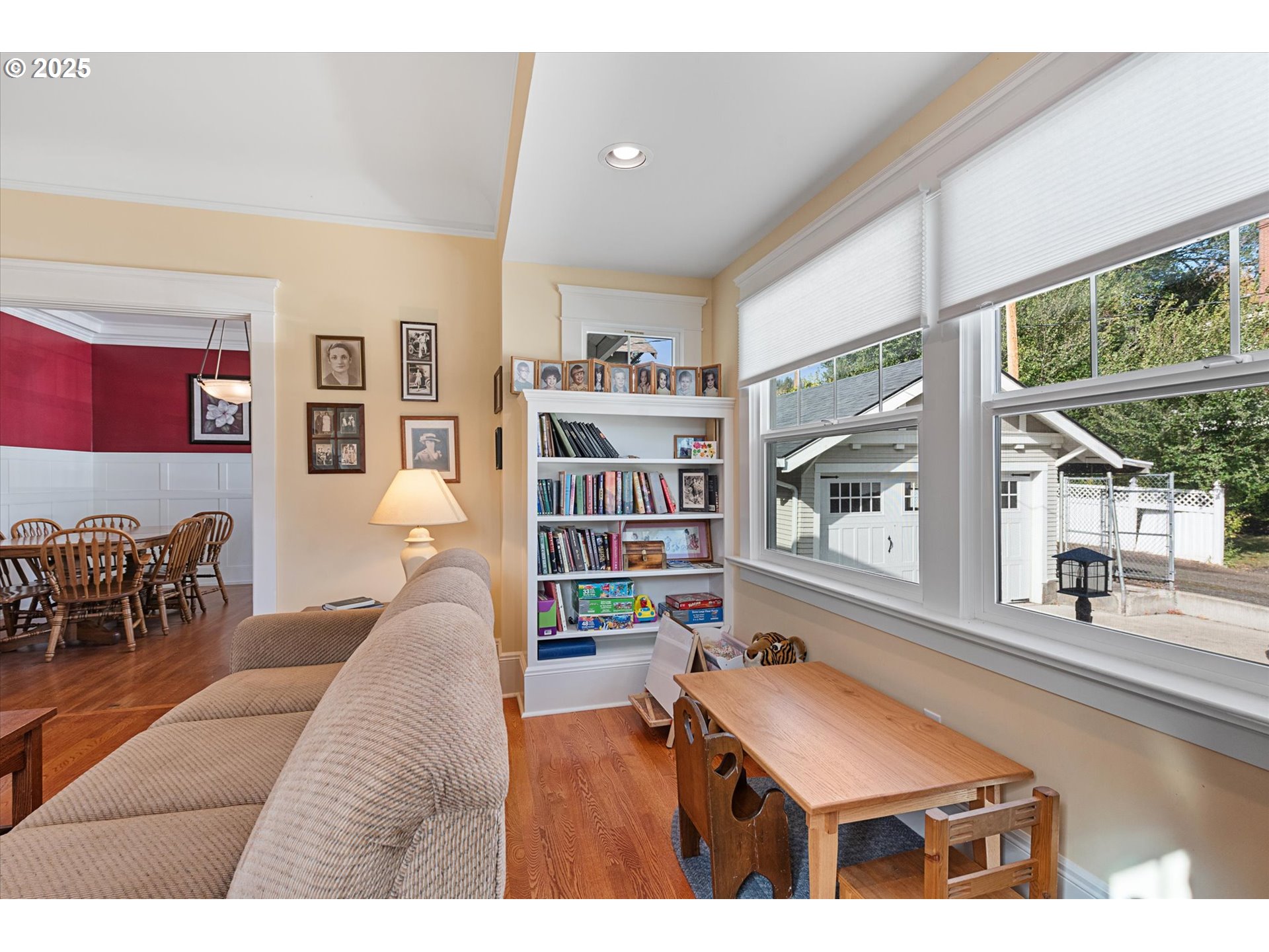 1402 2nd Street La Grande, OR 97850 - Photo 16 of 47 a living room with furniture a large window and bookshelf
