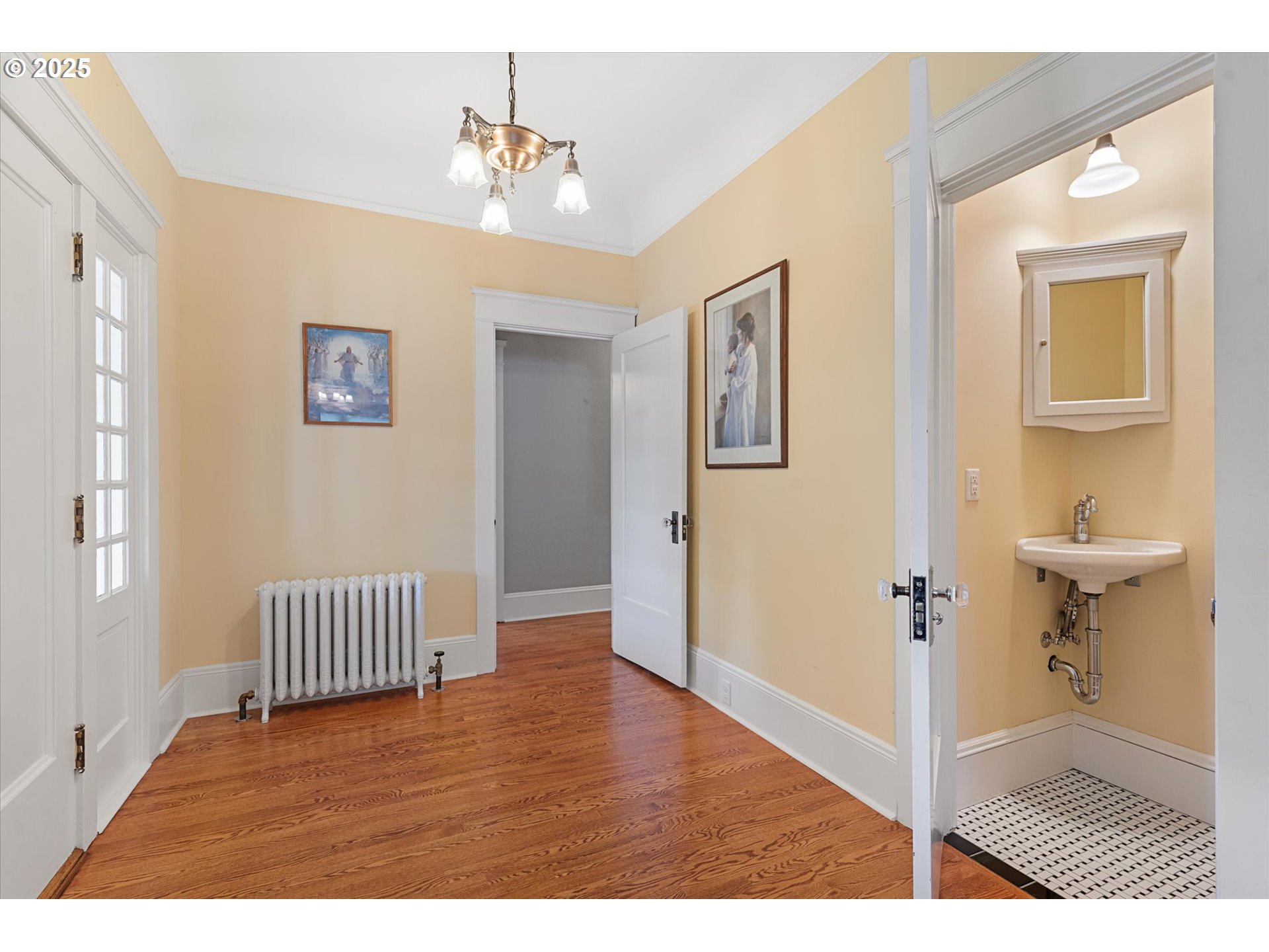 1402 2nd Street La Grande, OR 97850 - Photo 19 of 47 a view of a hallway with wooden floor and a bathroom