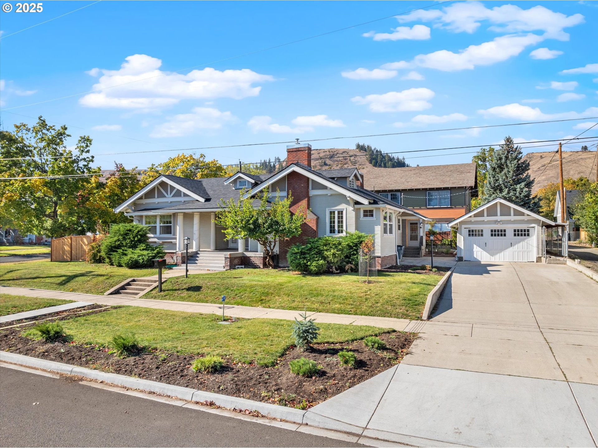 1402 2nd Street La Grande, OR 97850 - Photo 2 of 47 a front view of a house with a yard