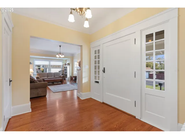 a living room with stainless steel appliances kitchen island granite countertop furniture and a view of kitchen