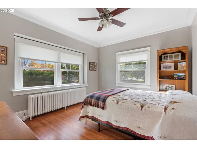 a bedroom with a large bed and a window
