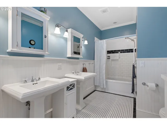 a bathroom with a sink a mirror and a shower