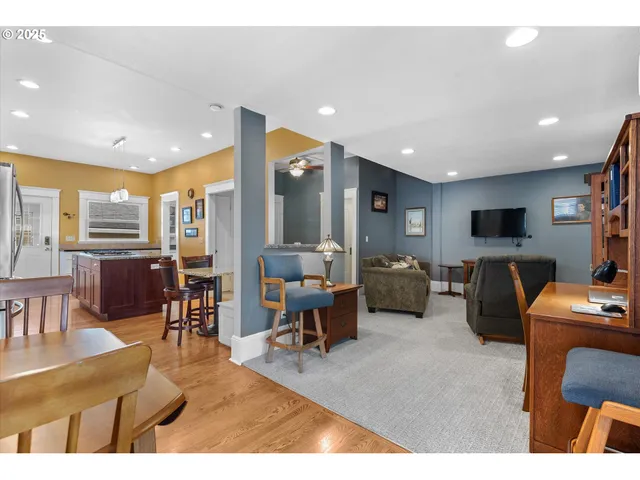 a living room with lots of furniture and a flat screen tv