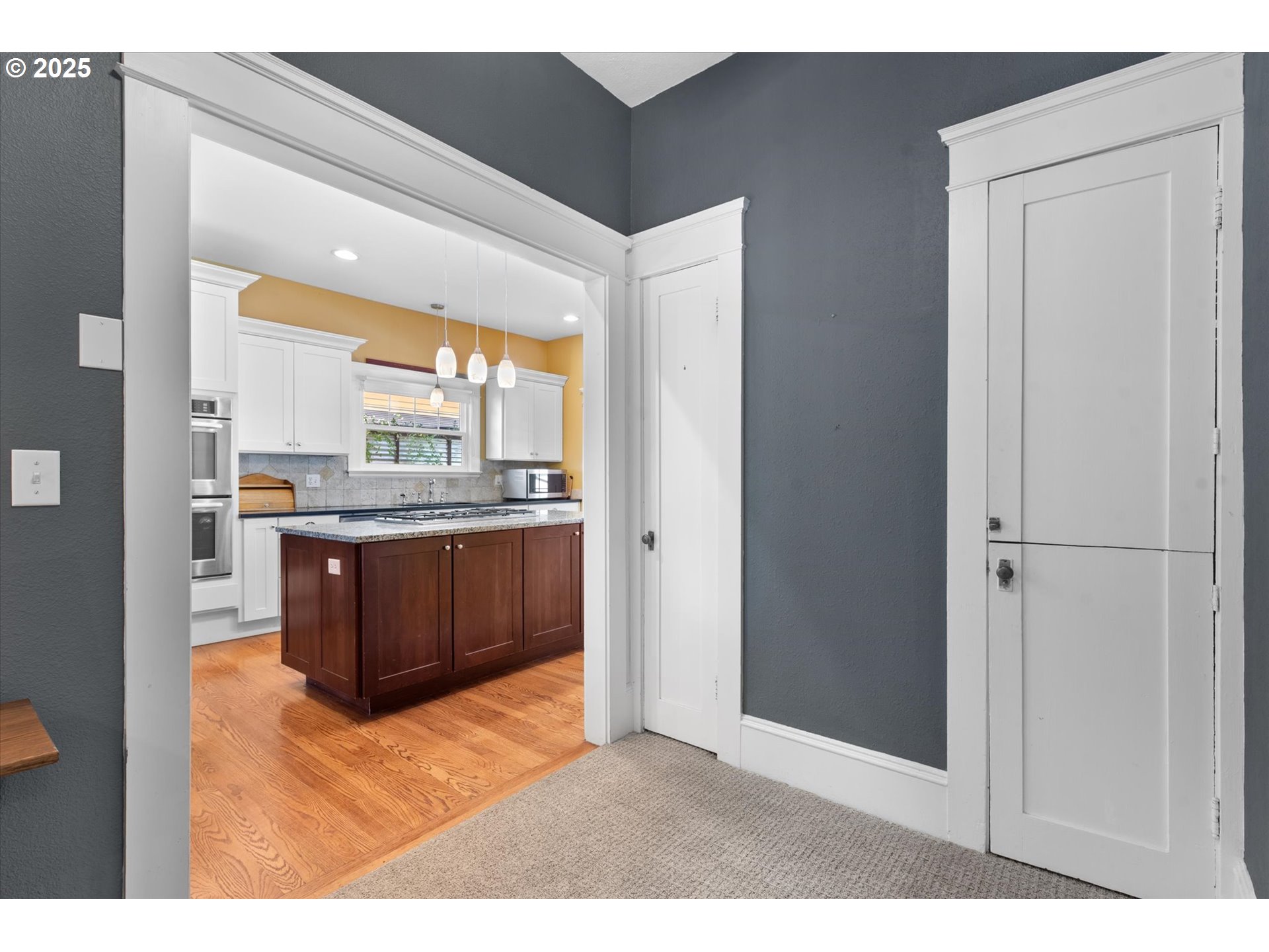 1402 2nd Street La Grande, OR 97850 - Photo 33 of 47 a bathroom with a vanity a sink a mirror and a window