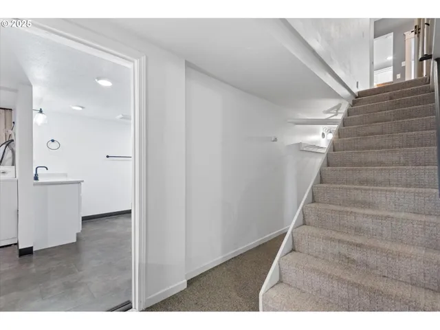 a view of an entryway with wooden floor
