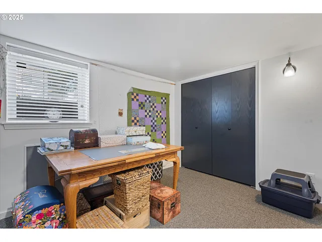 a view of a workspace with furniture