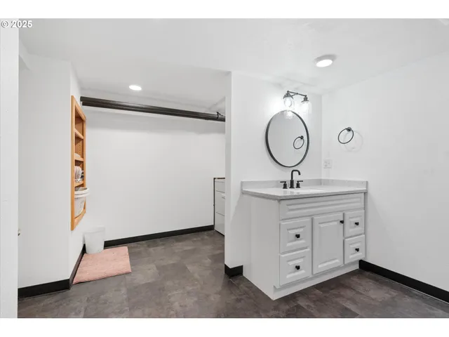 a view of a bathroom with a sink mirror and vanity
