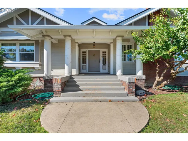 a front view of a house with garden