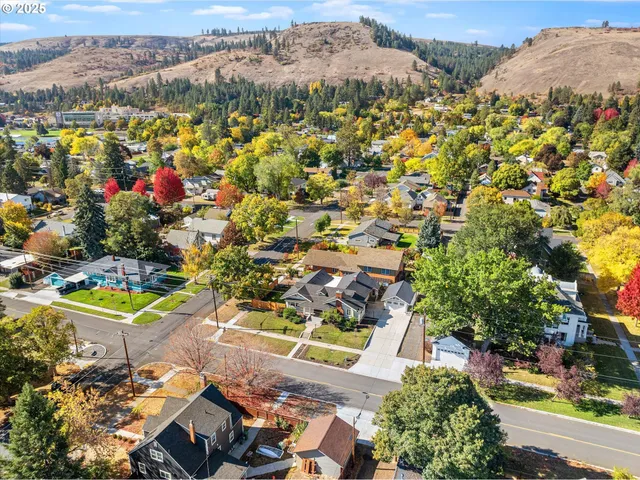 an aerial view of residential houses with outdoor space