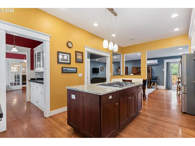 a kitchen with a stove and cabinets
