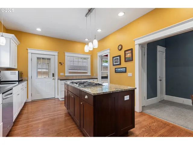 a kitchen with a stove and a refrigerator