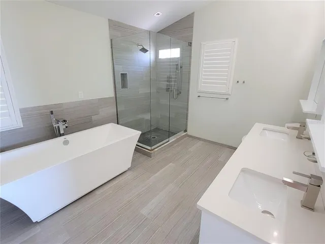 a bathroom with a sink and shower