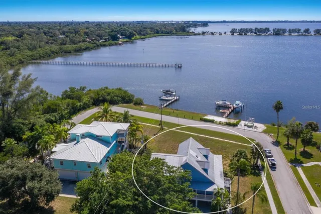 an aerial view of a house with a swimming pool