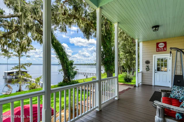 a front view of a house with a yard table and chairs