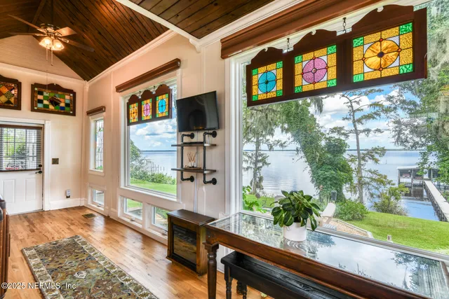 a living room with furniture and a book shelf