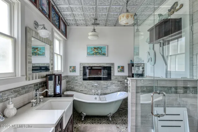 a bedroom with a bed dresser and a window