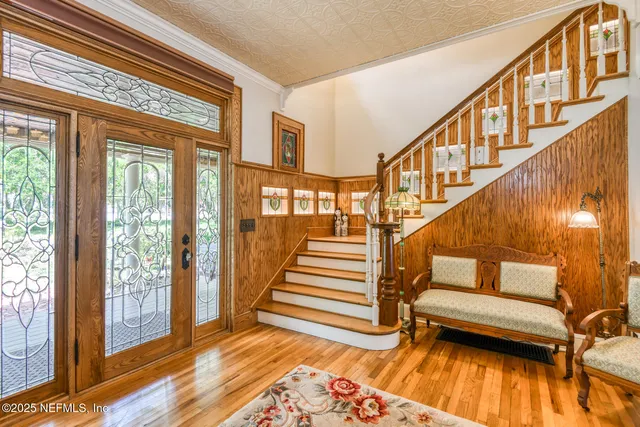 a room with furniture a flat screen tv and a fireplace