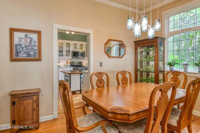 a front view of a house with a yard and plants