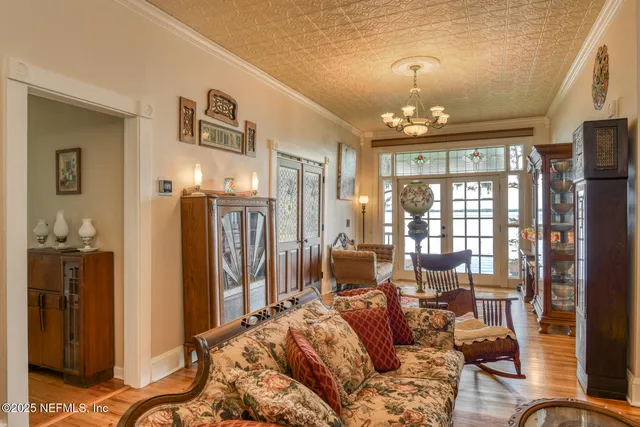 a front view of a house with a yard table and chairs