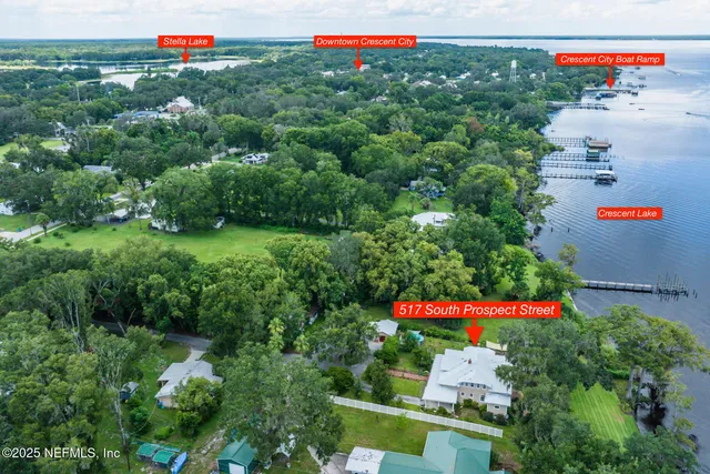 a view of backyard with swimming pool and seating area