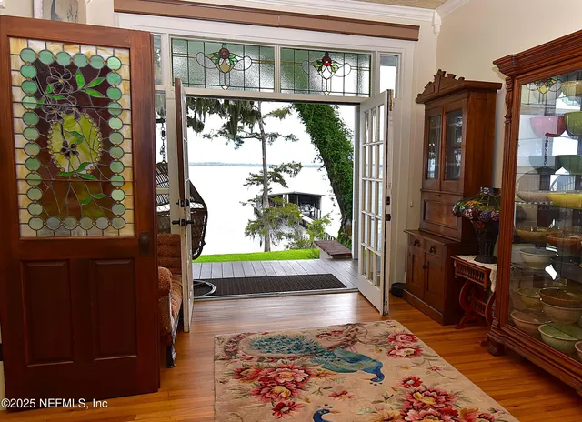 a kitchen with a stove a sink and a microwave