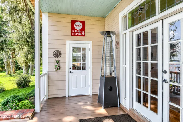 a view of a balcony with furniture and a window