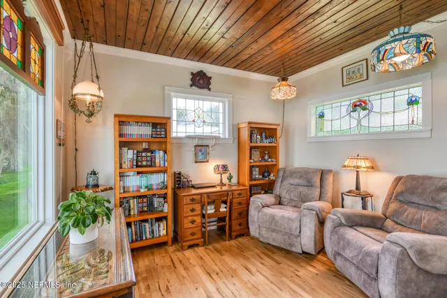 a front view of a house with yard and green space