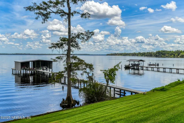 a front view of a house with a yard and porch