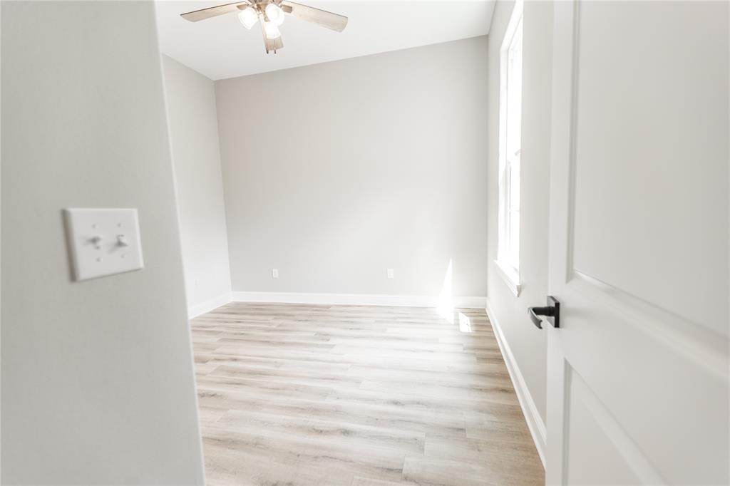 1025 VOSS Road Stonewall, LA 71078 - Photo 10 of 13 a view of a hallway with wooden floor
