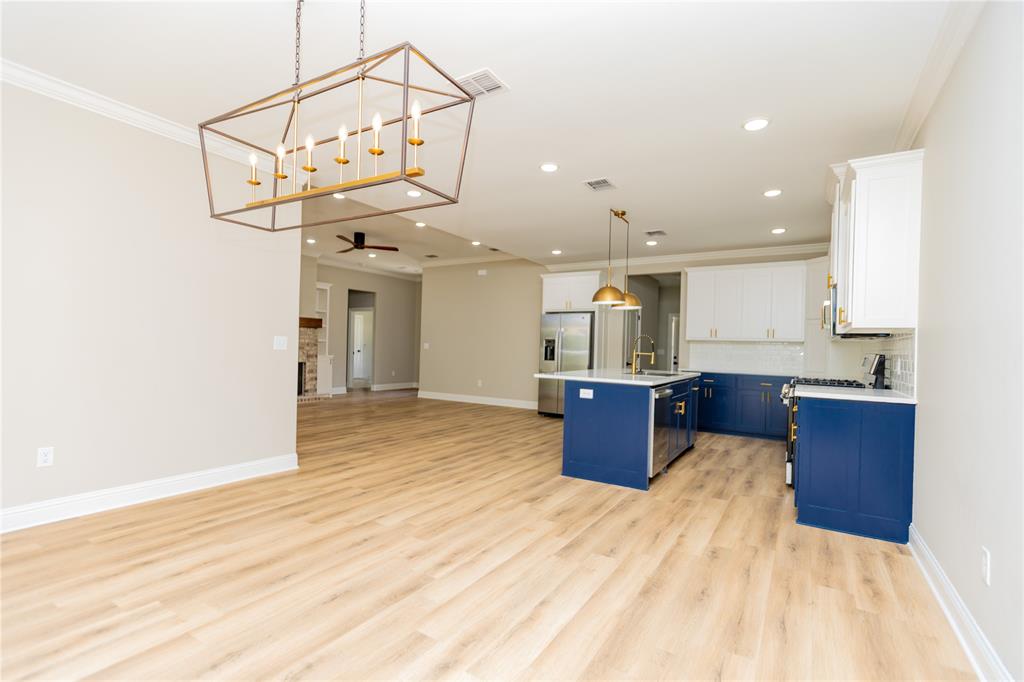 1025 VOSS Road Stonewall, LA 71078 - Photo 13 of 13 a kitchen with stainless steel appliances kitchen island a large island in the center