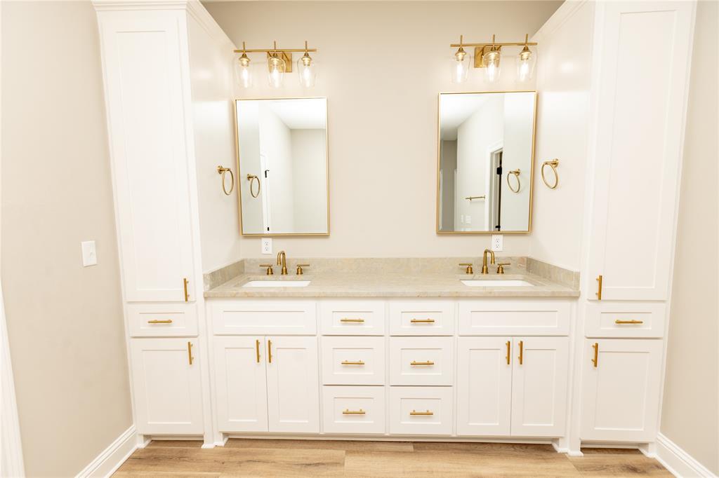 1025 VOSS Road Stonewall, LA 71078 - Photo 5 of 13 a bathroom with a sink vanity granite and a mirror