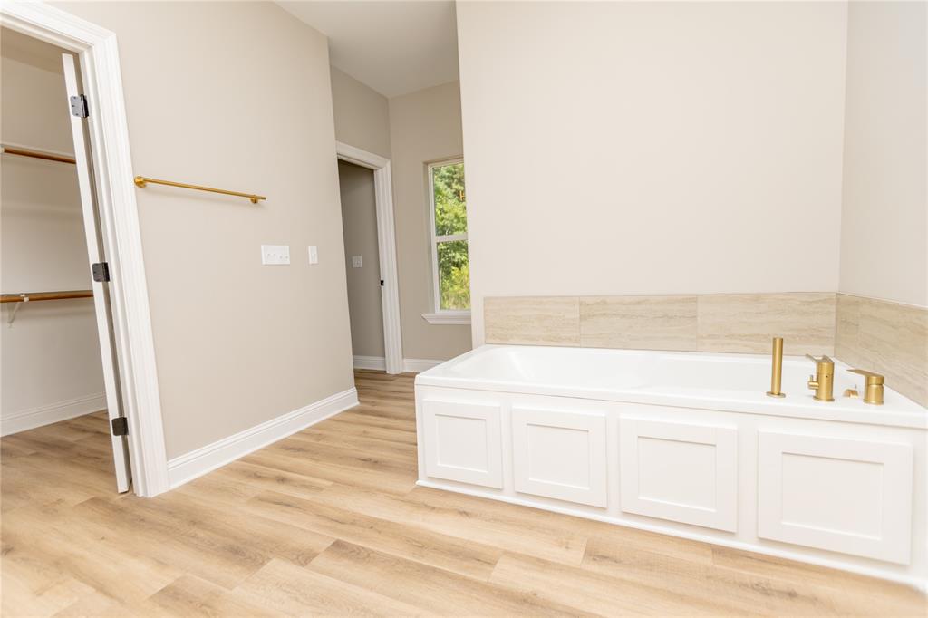 1025 VOSS Road Stonewall, LA 71078 - Photo 7 of 13 a bathroom with a tub and a sink