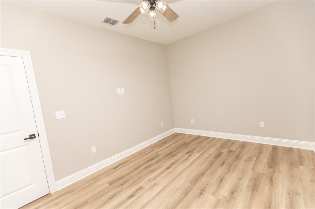 1025 VOSS Road Stonewall, LA 71078 - Photo 9 of 13 a view of an empty room with wooden floor
