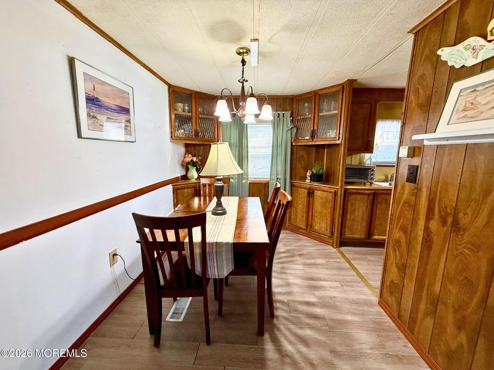 33 Judith Way Jackson, NJ 08527 - Photo 13 of 28 a view of a dining room with furniture window and wooden floor