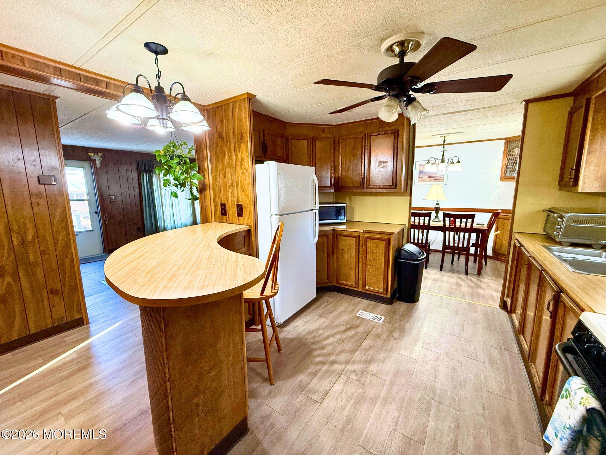 33 Judith Way Jackson, NJ 08527 - Photo 4 of 28 a view of a dining room with furniture window and wooden floor