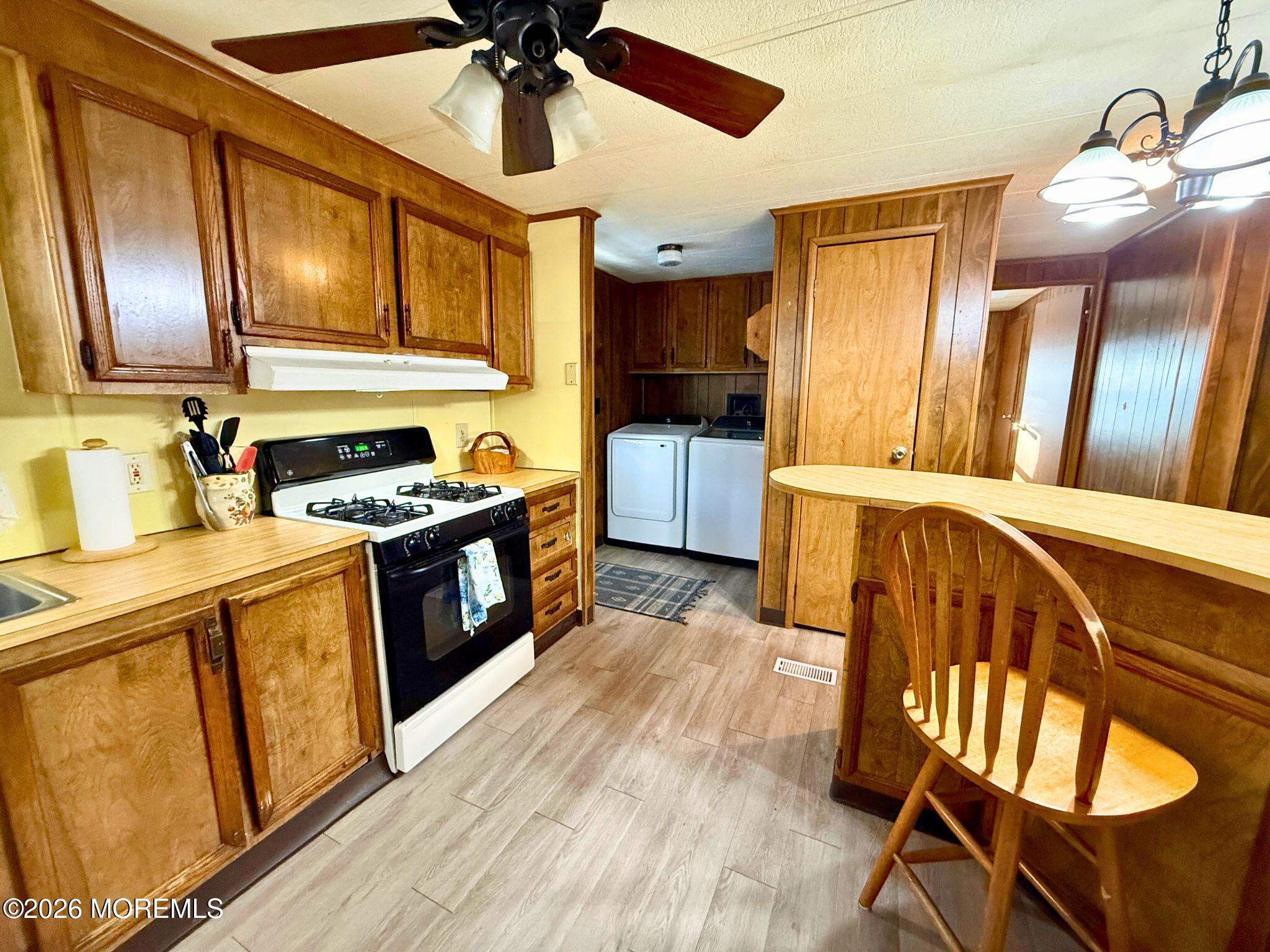 33 Judith Way Jackson, NJ 08527 - Photo 5 of 28 a kitchen with stainless steel appliances granite countertop a stove a sink dishwasher and a refrigerator