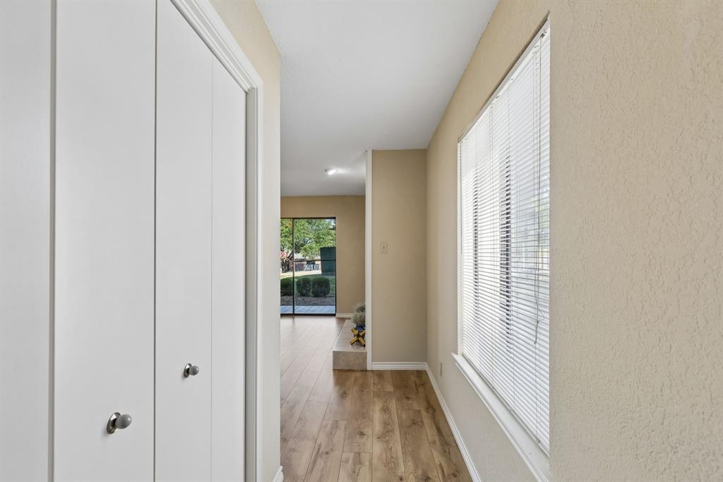 1121 Signal Ridge Place Rockwall, TX 75032 - Photo 3 of 26 Bright hallway featuring closet storage as you enter the home
