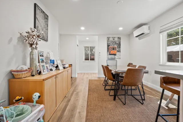 a dining room with furniture and window