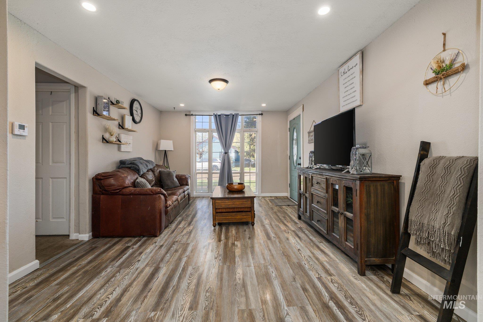 1504 2nd Street North Nampa, ID 83687 - Photo 7 of 29 Living area featuring light wood-type flooring and recessed lighting
