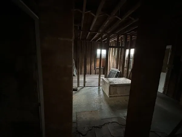 a view of a hallway with seating area