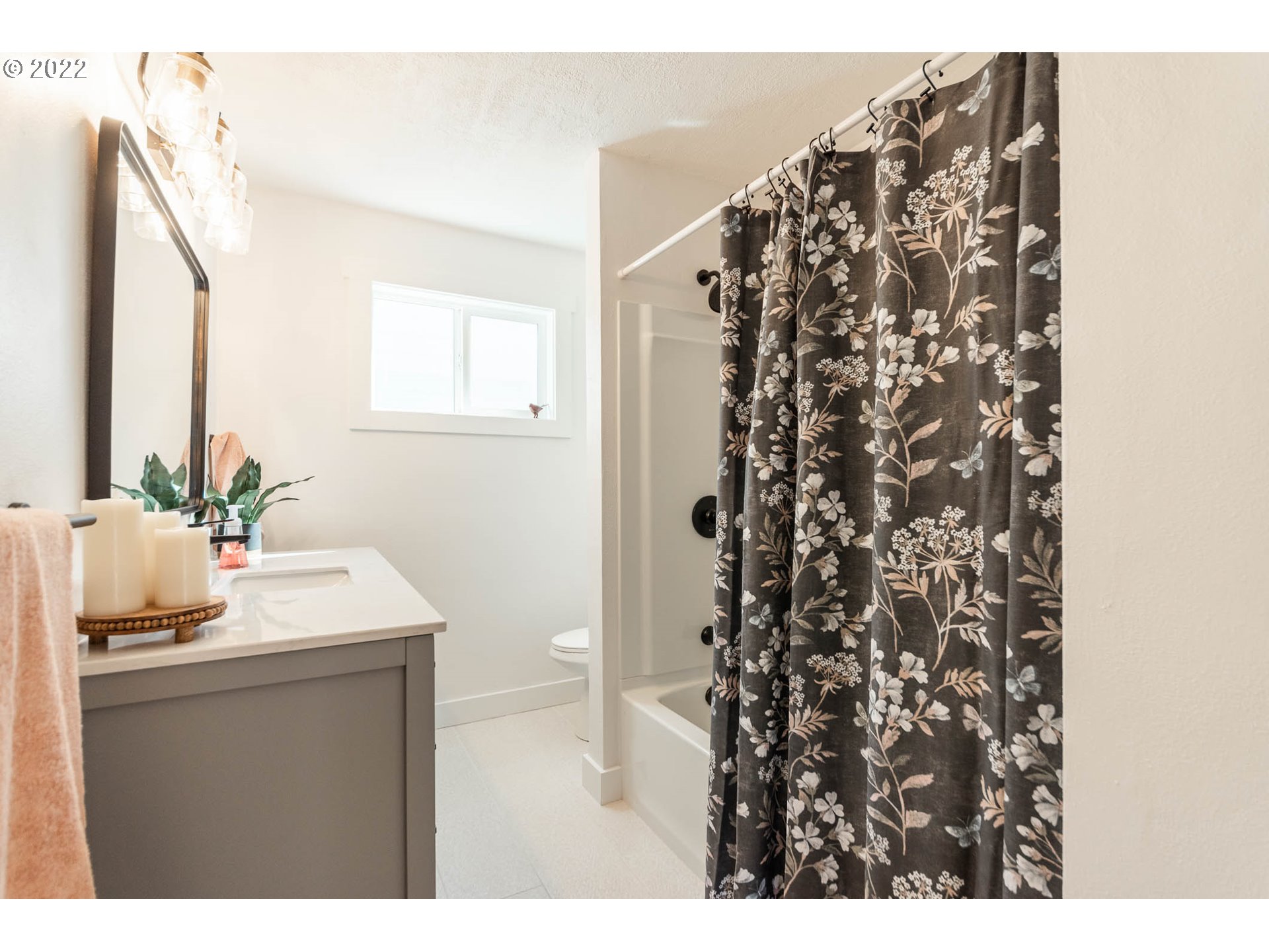 1218 N Street Springfield, OR 97477 - Photo 17 of 27 a bathroom with a sink and a mirror