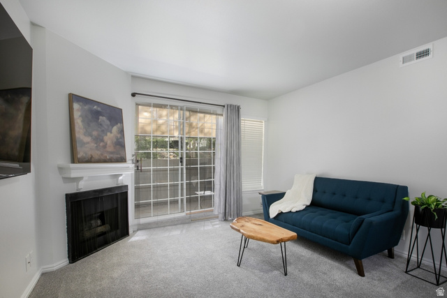 650 South Main Street, Unit 6103 Bountiful, UT 84010 - Photo 3 of 25 Living area with carpet and a fireplace