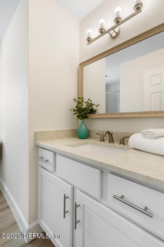 7214 Hernando Road Jacksonville, FL 32217 - Photo 12 of 21 a bathroom with a sink and a mirror
