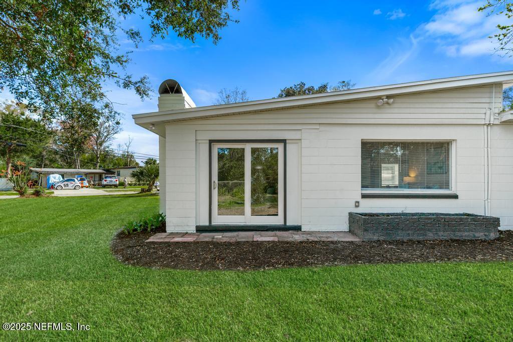 7214 Hernando Road Jacksonville, FL 32217 - Photo 19 of 21 a front view of a house with a yard