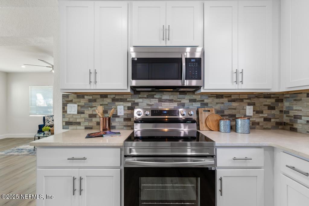 7214 Hernando Road Jacksonville, FL 32217 - Photo 8 of 21 a kitchen with a stove and a microwave