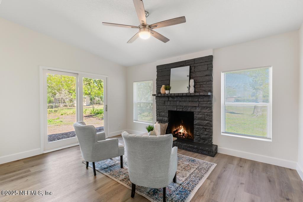 7214 Hernando Road Jacksonville, FL 32217 - Photo 10 of 21 a living room with furniture and a fireplace