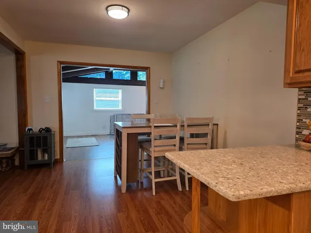 a kitchen with a table and chairs in it